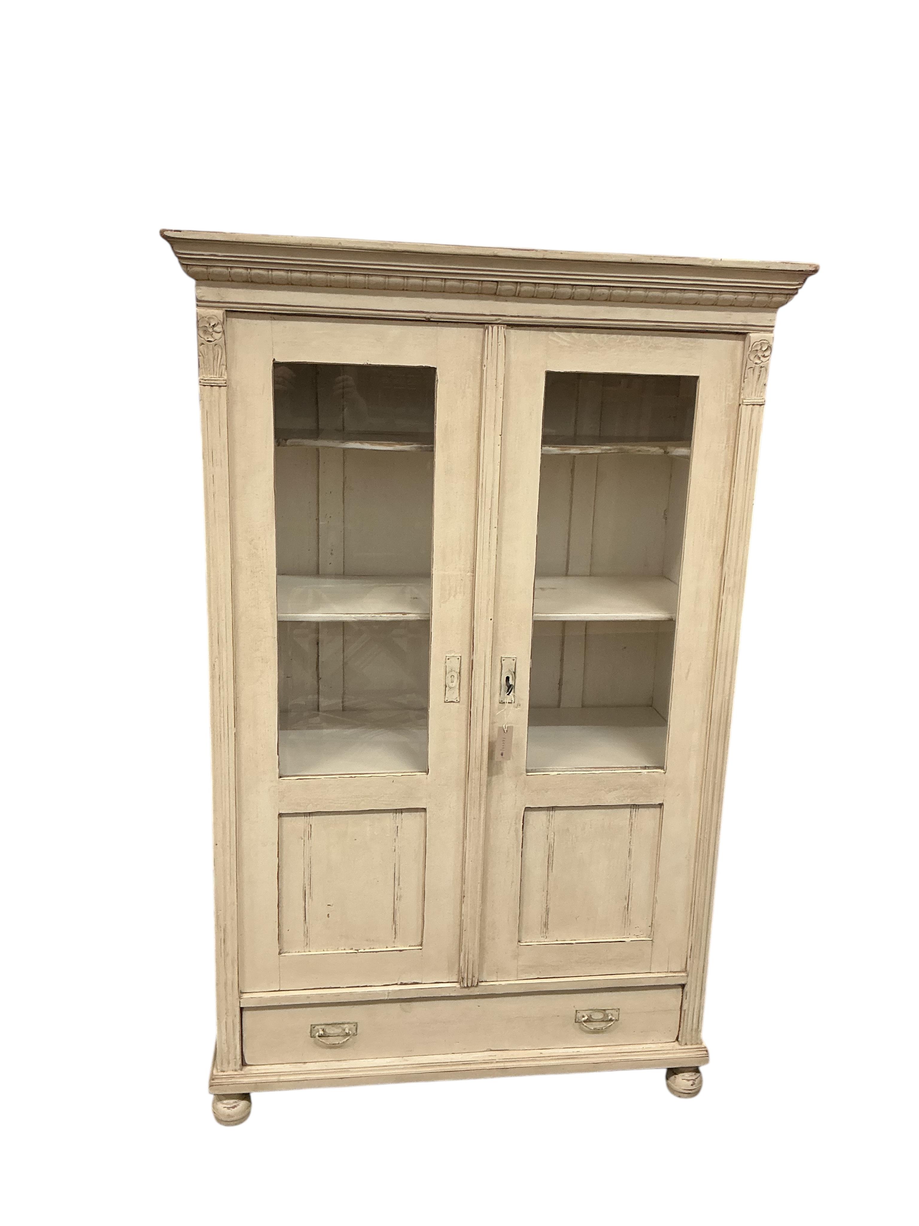 A 19th century East European painted glazed pine cabinet, width 114cm, depth 52cm, height 177cm